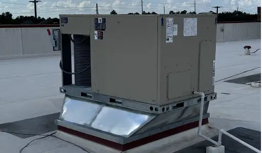 Rooftop package unit with a freshly fabricated galvanised curb transition